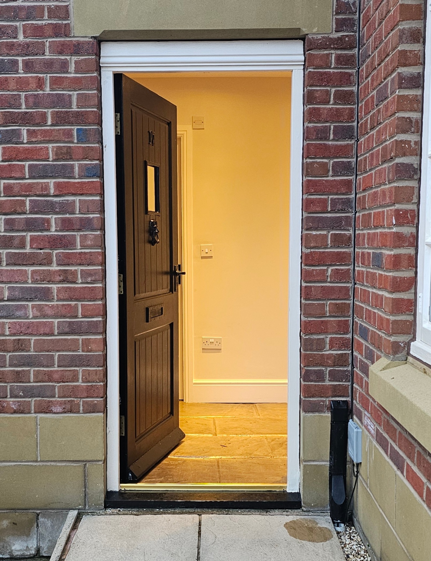 Professional locksmith installing a high-security lock on a residential door in Wrexham